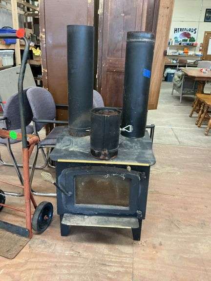 wood-burning stove with three extra stove pipes