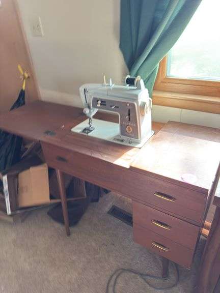 Singer sewing machine with cabinet