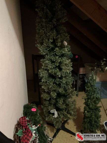 7 foot pre-lit Christmas tree and a 38” Christmas tree with lights on it ￼