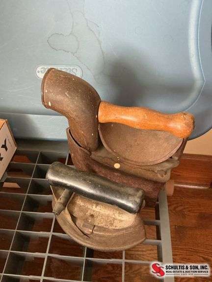 Large sad iron with fuel compartment, and smaller sad iron