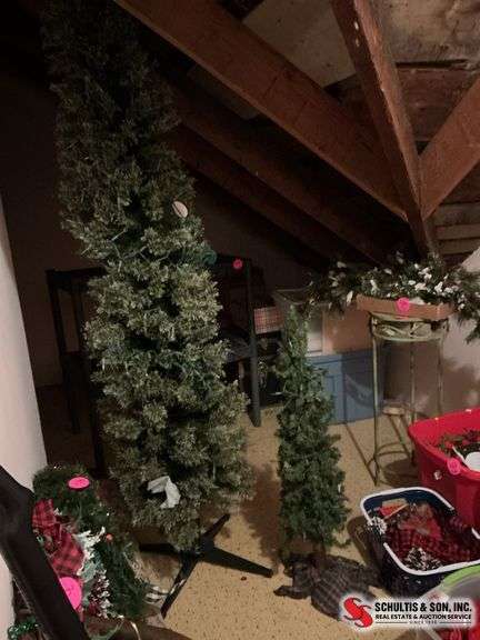 7 foot pre-lit Christmas tree and a 38” Christmas tree with lights on it ￼