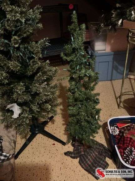 7 foot pre-lit Christmas tree and a 38” Christmas tree with lights on it ￼
