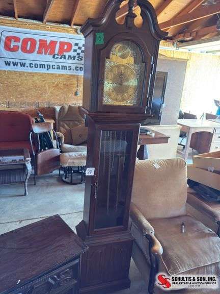 Grandfather clock , weights and pendulum in office