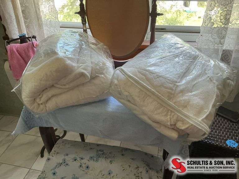 2 mattress pad protectors, and a flat sheet for a queen size bed ￼