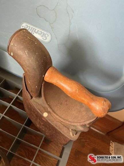 Large sad iron with fuel compartment, and smaller sad iron