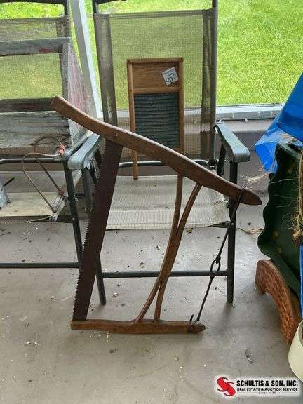 Antique washboard and buck bow saw
