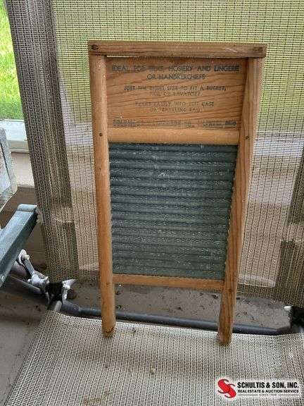 Antique washboard and buck bow saw
