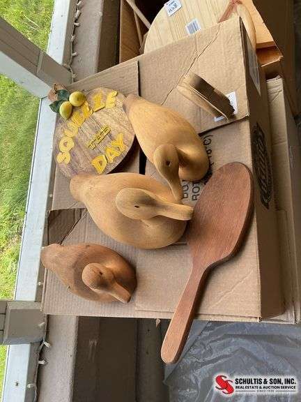 Wooden duck decoys, paddle and lemon cutting board