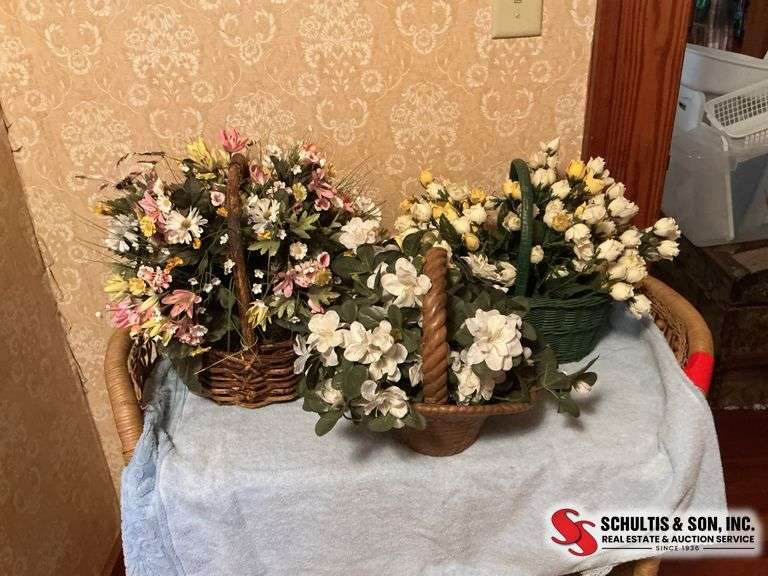 Beautiful floral arrangements in baskets ￼