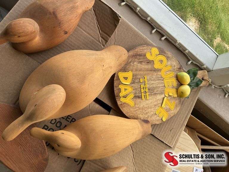 Wooden duck decoys, paddle and lemon cutting board