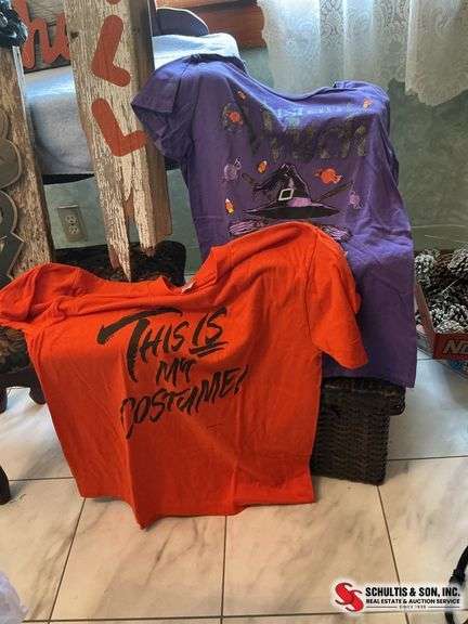 unique Halloween decor made out of wood and two Halloween t-shirts sizes, large and extra large ￼