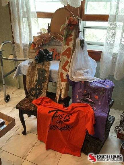 unique Halloween decor made out of wood and two Halloween t-shirts sizes, large and extra large ￼