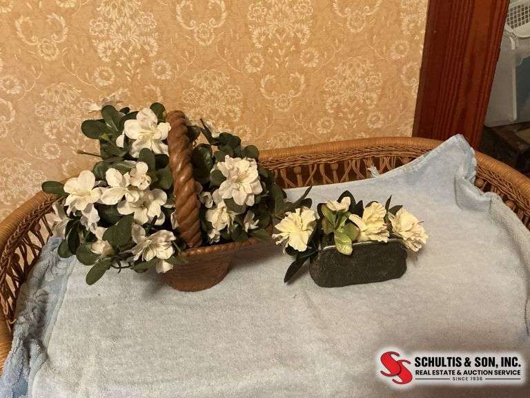 Beautiful floral arrangements in baskets ￼