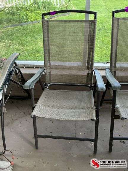 ￼ brown and tan folding chair