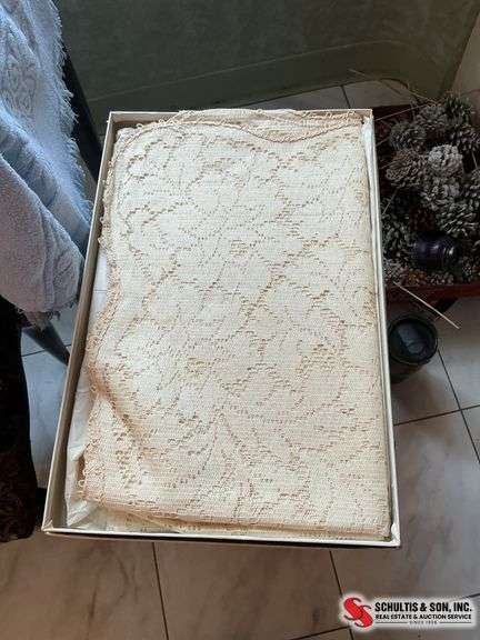 wallhangings and a beautiful lace tablecloth ￼