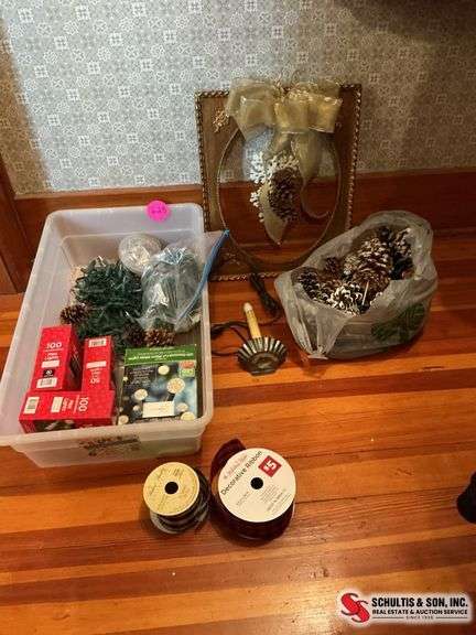packages of mini lights- bag of pinecones-wall hanging- ribbon ￼