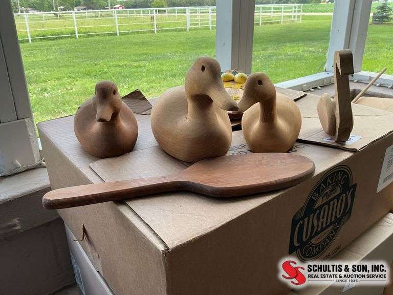 Wooden duck decoys, paddle and lemon cutting board
