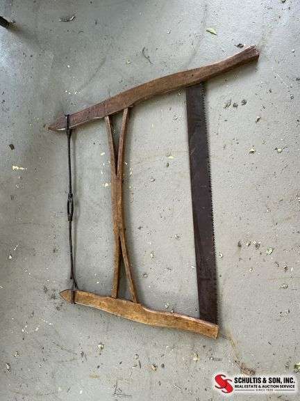 Antique washboard and buck bow saw