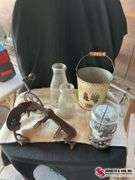 Antique apple peeler & glass milk bottles