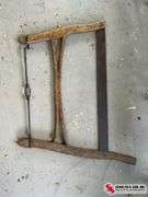 Antique washboard and buck bow saw
