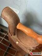 Large sad iron with fuel compartment, and smaller sad iron