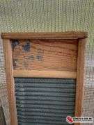 Antique washboard and buck bow saw