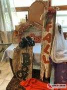 unique Halloween decor made out of wood and two Halloween t-shirts sizes, large and extra large ￼