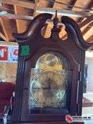 Grandfather clock , weights and pendulum in office