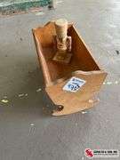 Small wooden nutcracker and small cradle