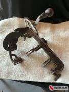 Antique apple peeler & glass milk bottles