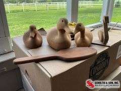Wooden duck decoys, paddle and lemon cutting board