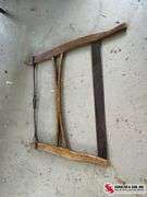Antique washboard and buck bow saw