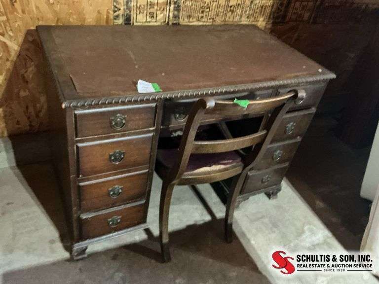Antique desk with ornate trimming  with chair   leather top very sturdy