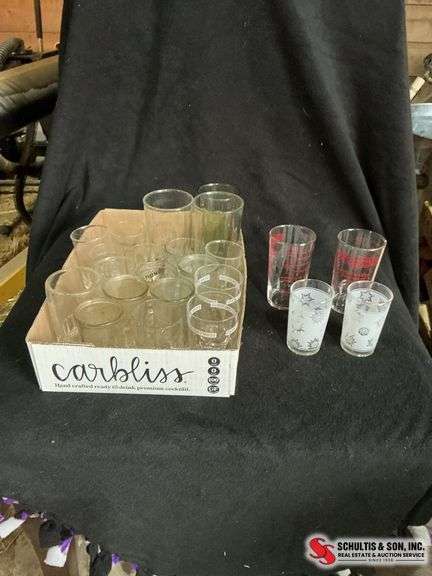 2 frosted atomic small juice glasses-  advertising measuring cups and other tumblers and juice glas