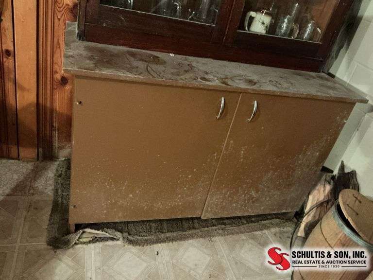 Wooden cabinet in basement contents not included