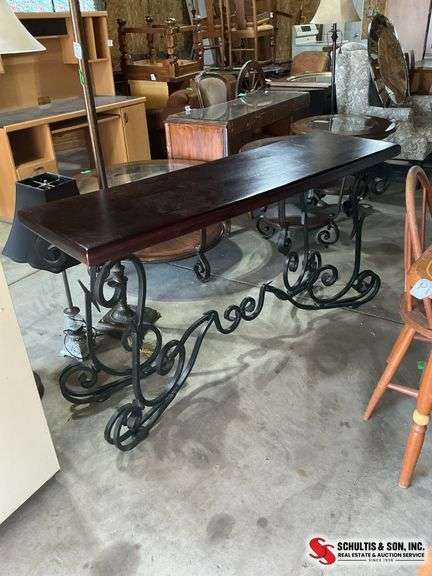 black solid wood console table with wrought iron legs in very good condition (59”W X 18”D X 31”H)