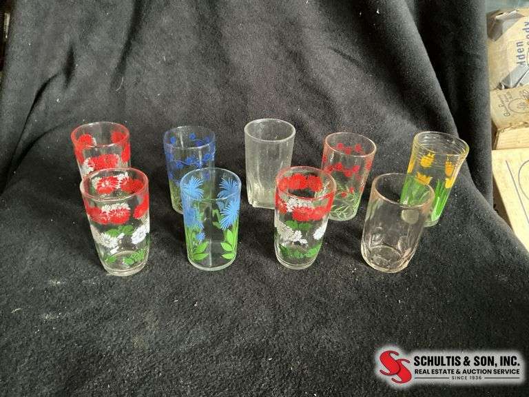 variety of floral design juice glasses and clear ones 