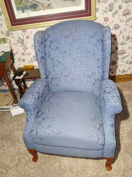 Wingback Recliner Chair with a Floral Pattern.