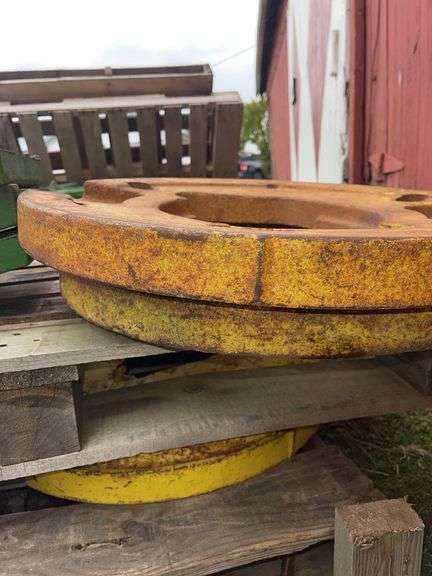 Four John Deere Wheel Weights