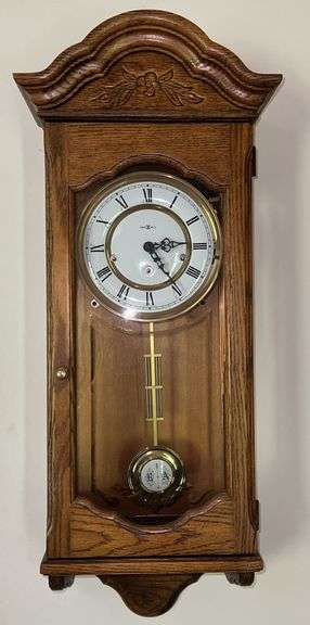 Howard Miller Oak Regulator Wall Clock (32”T,10.5”L,7”D)