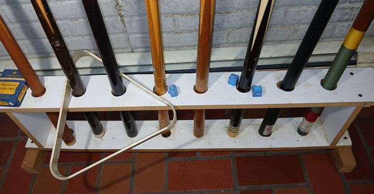 Seven Cue Sticks, One Shot Assist, & Cue Stick Rack