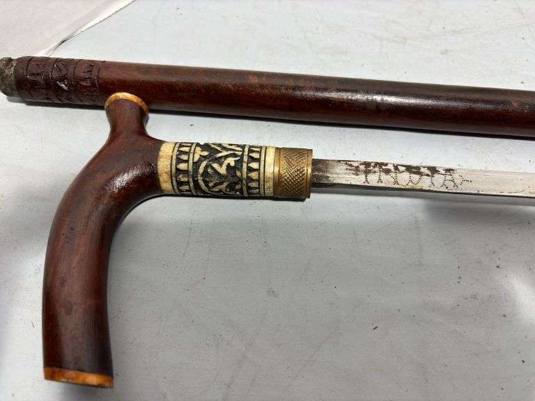 Three Hand Carved Sword Canes
