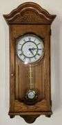 Howard Miller Oak Regulator Wall Clock (32”T,10.5”L,7”D)
