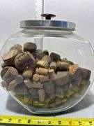 Glass Cookie Jar Containing Various Sizes of Corks