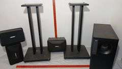 Four Bose Speakers and Two Stands