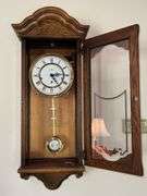 Howard Miller Oak Regulator Wall Clock (32”T,10.5”L,7”D)