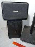 Four Bose Speakers and Two Stands