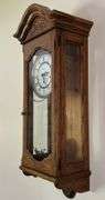 Howard Miller Oak Regulator Wall Clock (32”T,10.5”L,7”D)
