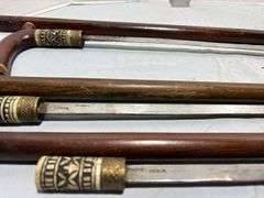 Three Hand Carved Sword Canes