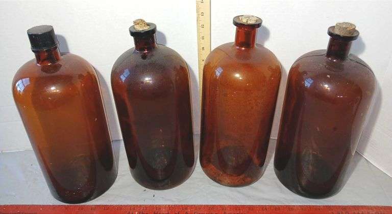 Four 13" Tall Brown Glass Apothecary Bottles